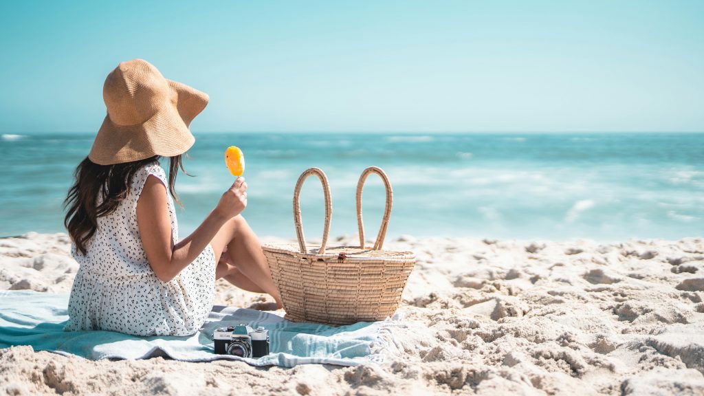 A woman enjoying a relaxing beach picnic- Panglao Island Tour